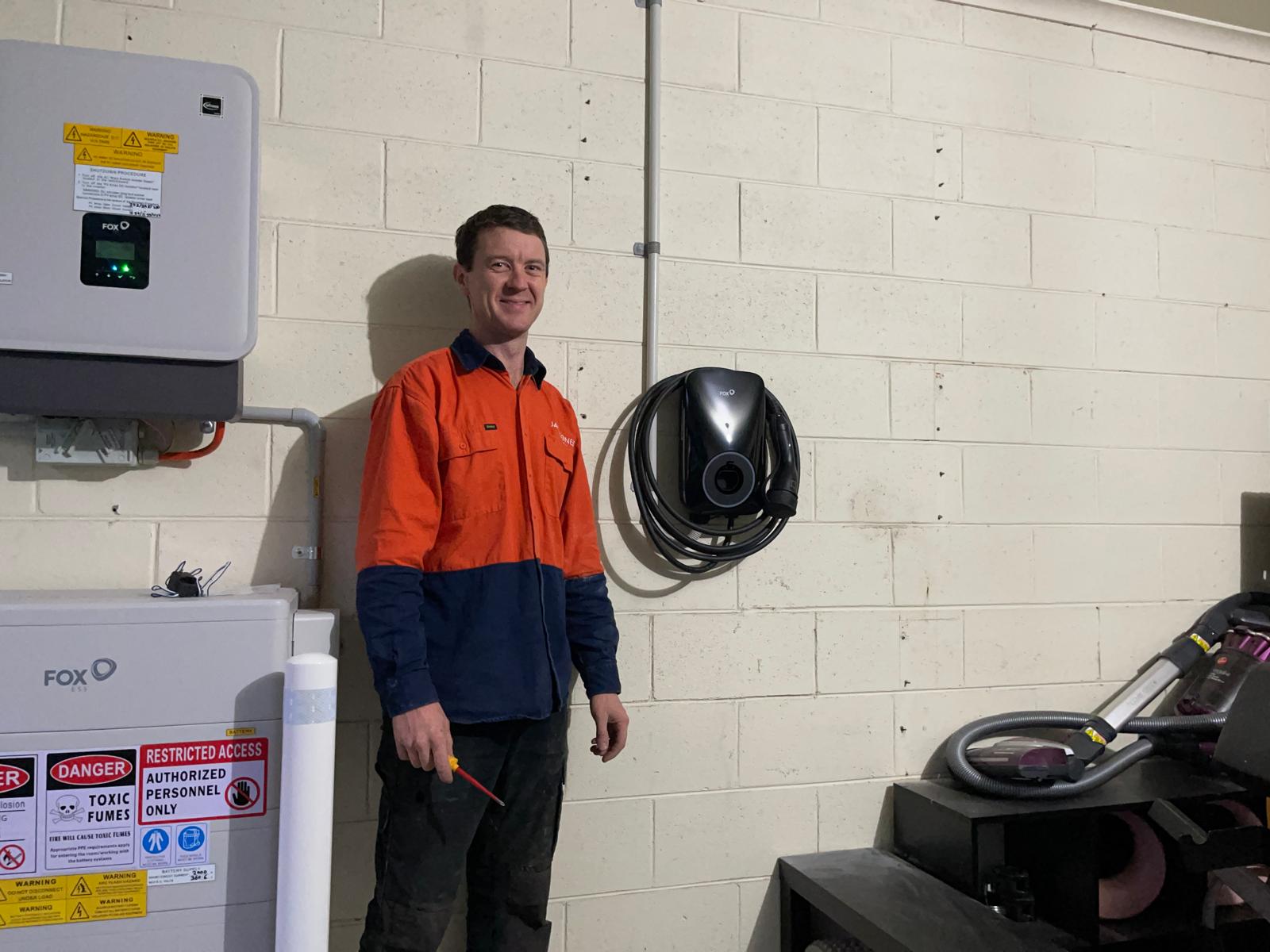 Fox ESS EV charger installed in a garage alongside a Fox ESS battery system by Jack Jones Electrical